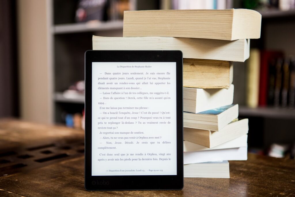 ebook in front of book stack