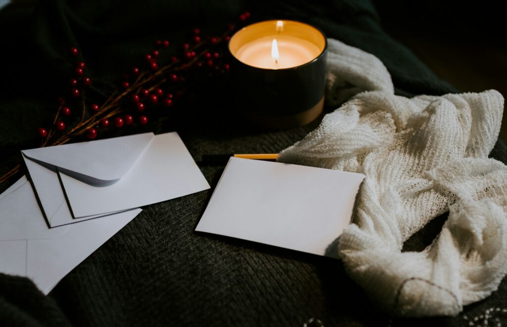 Writing letters by candlelight - Photo by Kelly Sikkema on Unsplash