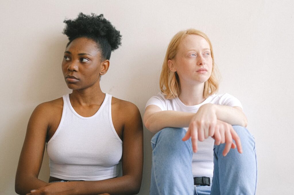 Two girls in a disagreement to illustrate how to write an argument - Photo by Anna Shvets